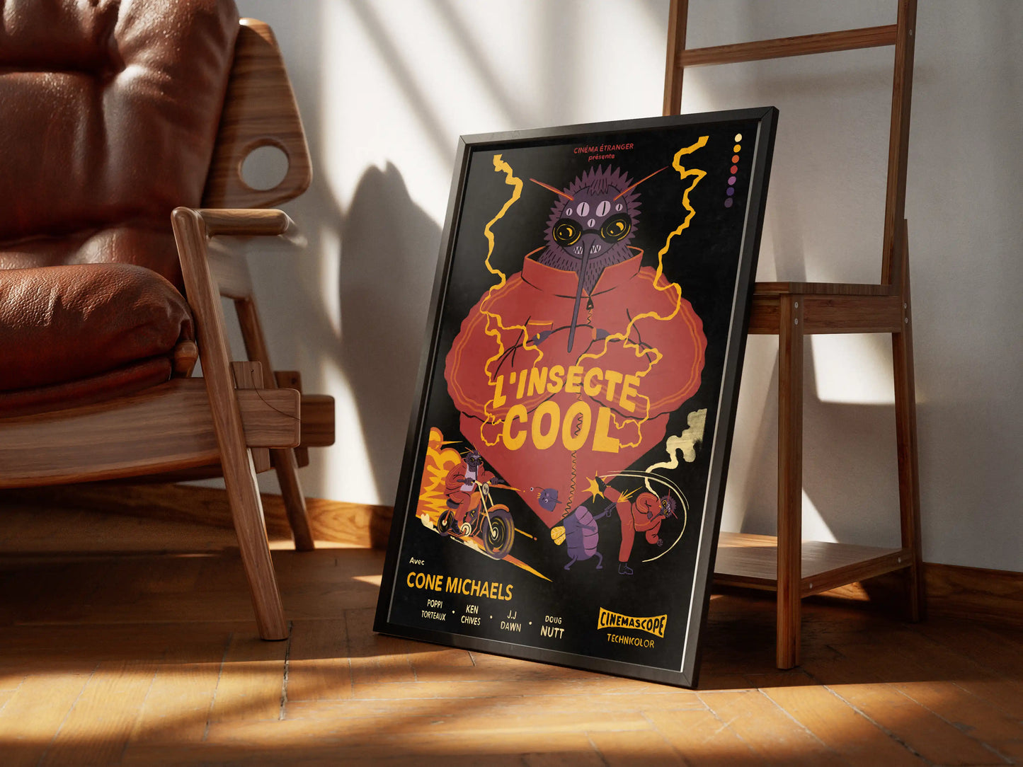 Framed ‘L’insecte Cool’ French bug-noir poster by NYC artist Max Kolo resting on a sunlit wooden floor beside mid-century chairs, featuring a bold retro insect character illustration.