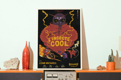 Framed ‘L’insecte Cool’ French bug-noir poster by NYC artist Max Kolo displayed on a mid-century wooden stereo shelf with ceramic decor, featuring a bold retro insect character illustration.