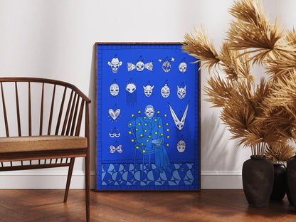 Framed Mask Salesman art print by Max Kolo resting on the floor between a wooden chair and tall dried plants, featuring a surreal blue design with expressive white masks.