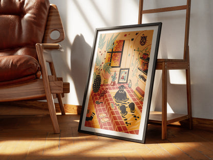 Framed artwork of a dog taking a bath in a tiled room filled with plants leaning on a stair next to a brown leather chair. Illustrated by New York City artist Max Kolo. 