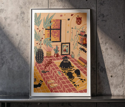 Framed “Me Time” art print by Max Kolo leaning against a textured concrete wall, shown in warm natural light. The illustration features a cozy indoor room with a black dog relaxing in a tiled bath area surrounded by plants, artwork, shelves, and soft pastel decor.