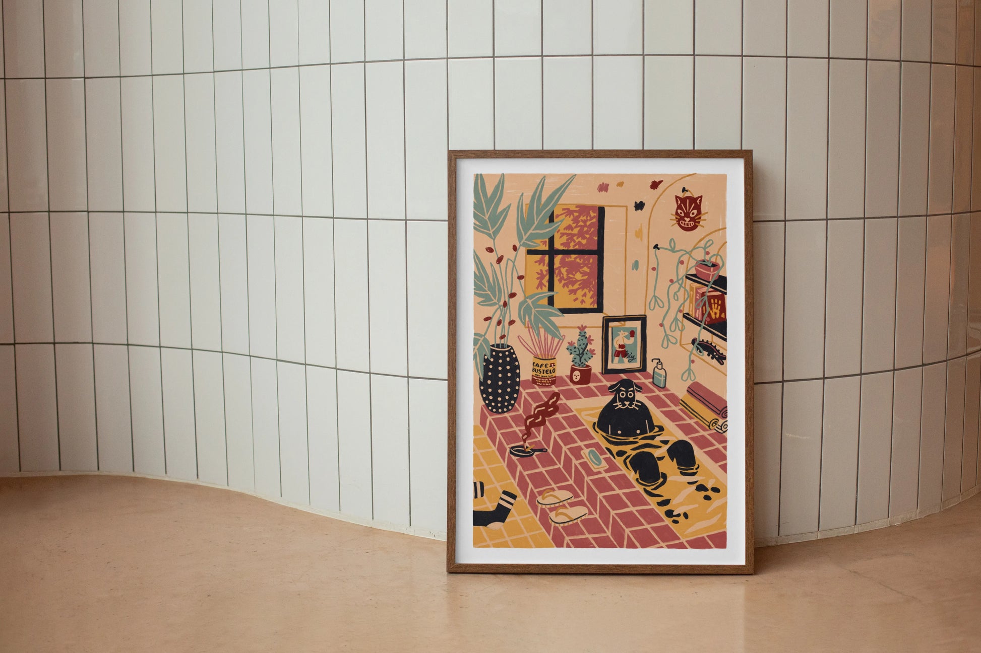 Framed artwork on a tiled wall of a dog taking some alone time by taking a bath. Illustrated by New York City artist Max Kolo. 