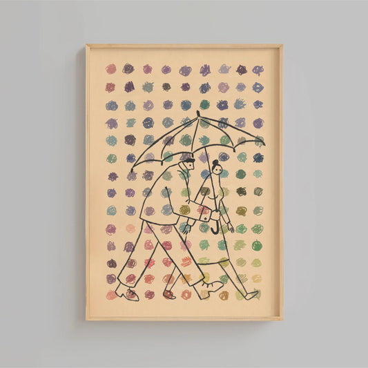 Framed artwork of two people under an umbrella with a patterned background and dots of multiple colors in the foreground set on a gray wall. Artwork by New York City Artist Max Kolo.