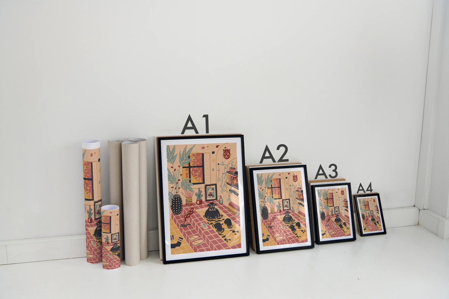 Set of framed artworks with labels on a white surface. Illustrated by New York City artist Max Kolo. 